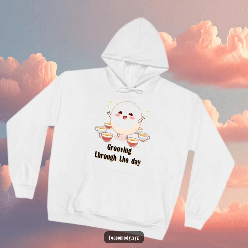 Funny hoodie featuring an ecstatic rice ball character doing a comical dance amidst tiny tea cups, ideal for a cozy, humorous feel.